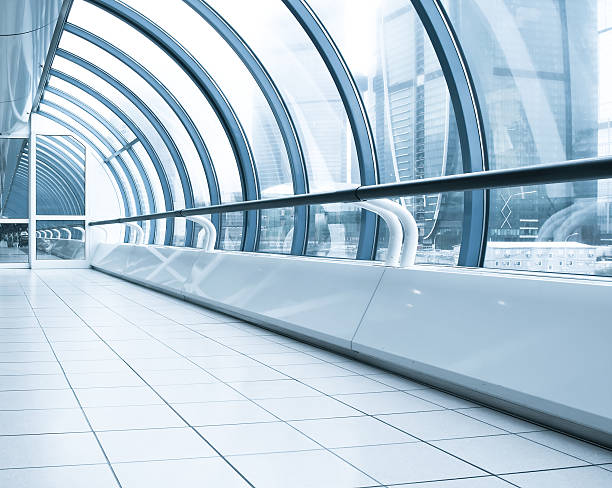 istock vanishing corridor in contemporary airport walkway 483673421