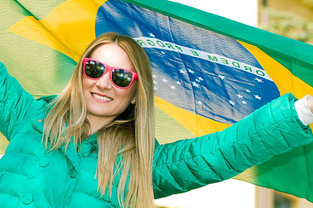 istock Brazilian supporter with flag 483674225