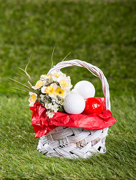 Easter Basket with Golf Balls and Flowers stock photo