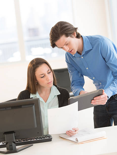 istock Business Colleagues Discussing Over Digital Tablet 483675217