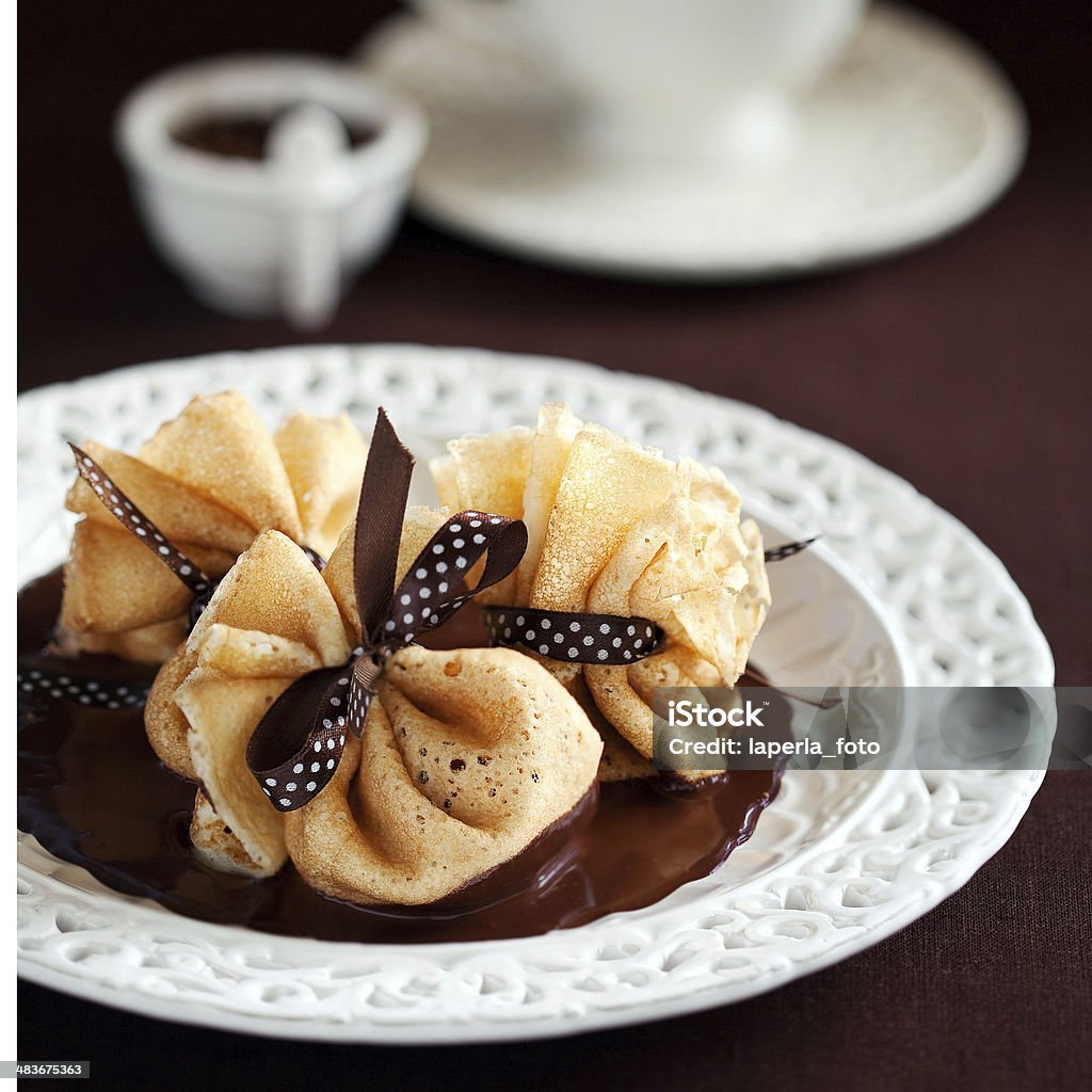 Pancake bags Pancake bags with cream cheese and chocolate sauce, selective focus Blini Stock Photo