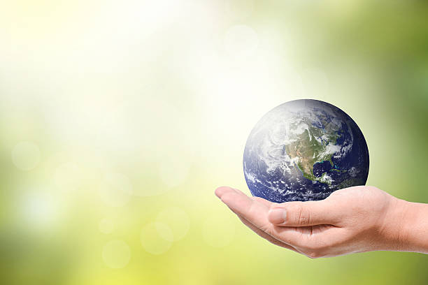 istock Male hand holding the Earth 483675502