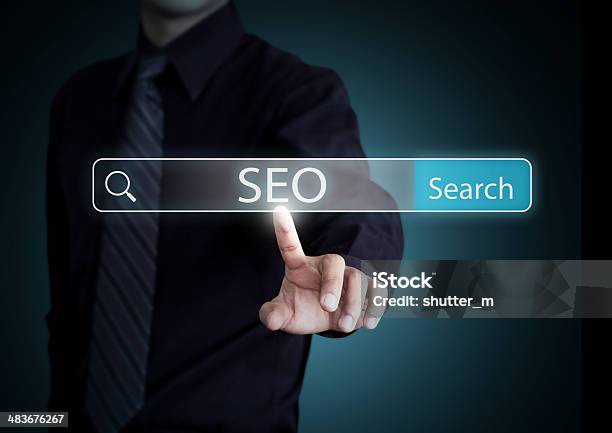 Businessman Search On Virtual Screen With Seo Process Information Stock Photo - Download Image Now