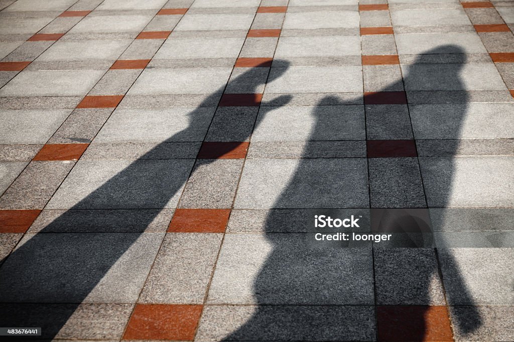 Shadow of girl bowed to Confucius Shadow of girl bowed to Confucius on floor in sunlight 16-17 Years Stock Photo