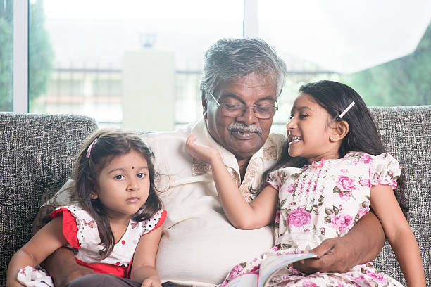 istock Family reading story book 483677772