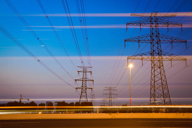 istock the high voltage electricity pylon in side of highway 483687479