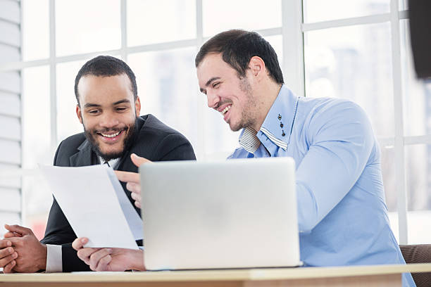 istock Good job. Two Confident businessman with a smile check documents 483687534