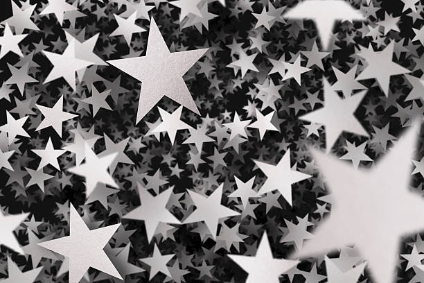 istock Hundreds of silver confetti stars 483687653