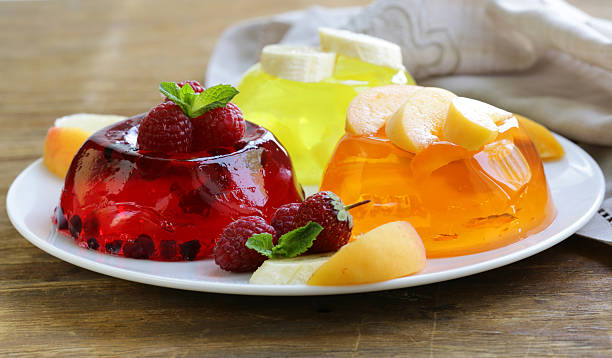 berry fruit jelly with fresh berries - summer dessert