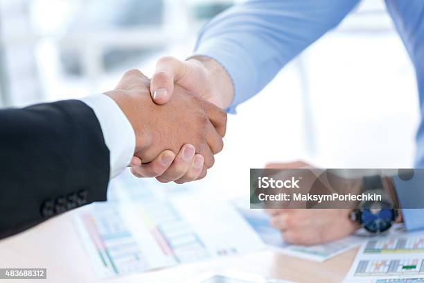 Men Shaking Hands Confident Businessman Shaking Hands With Each Stock Photo - Download Image Now