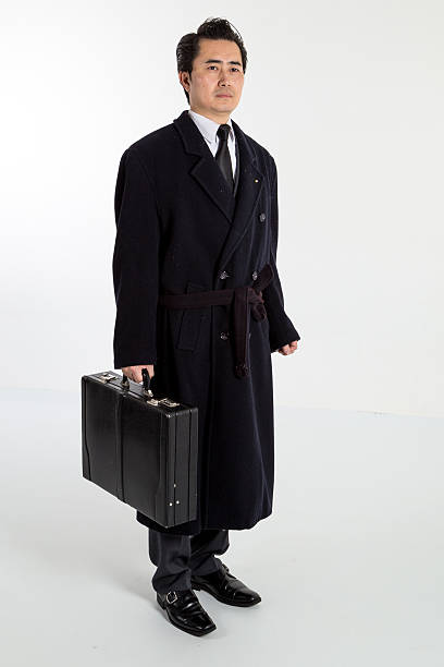 istock Chinese business man standing with suitcase 483688535