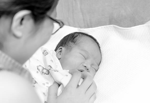 istock Mother lull her infant daughter before sleep 483689130