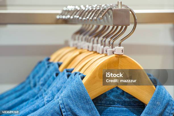 Jeans Shirts On The Hangers Stock Photo - Download Image Now - Boutique, Business, Button Down Shirt