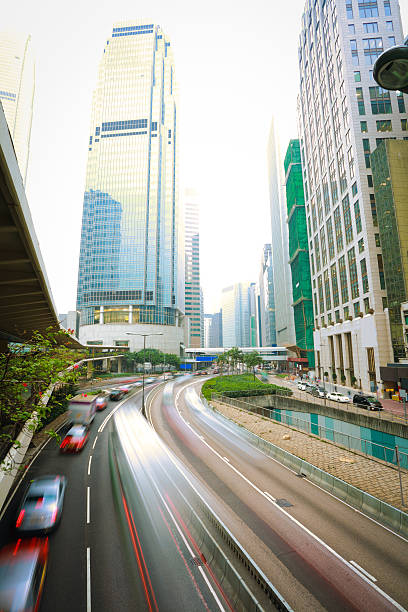 istock Road light trails on streetscape buildings in HongKong 483689691