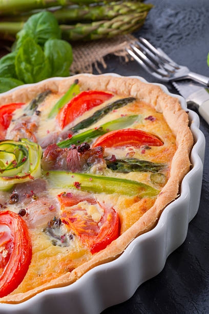 istock green asparagi Tart with eggs and tomato 483691207