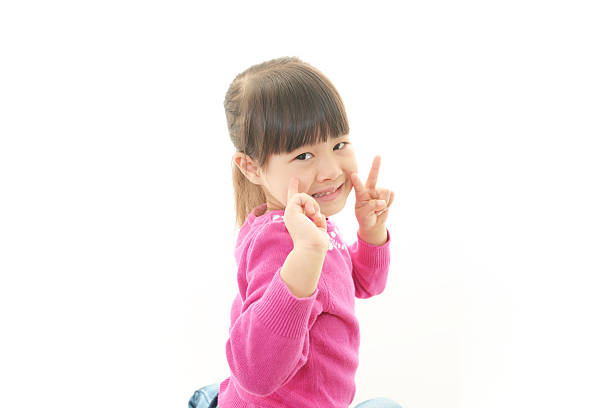 istock Pretty little girl makes a victory sign 483691221
