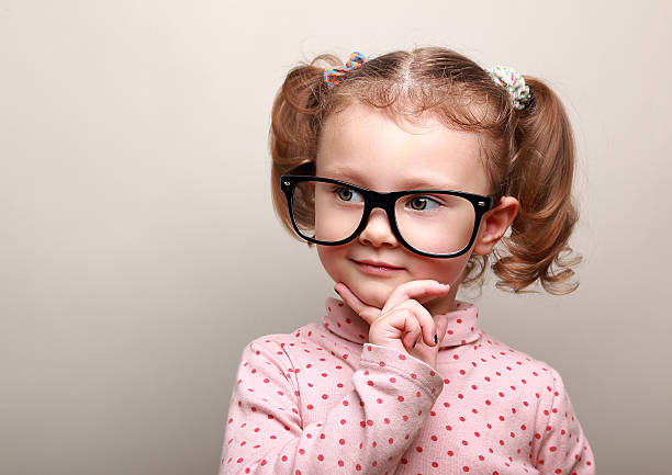 istock Cute fun kid girl thinking about and looking 483691395