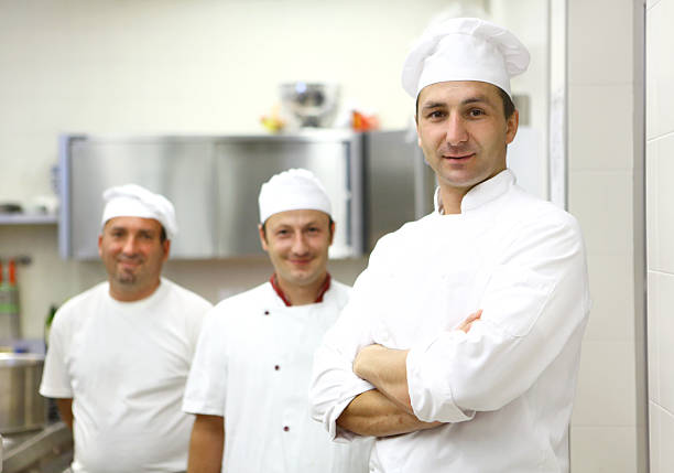 istock Group  of chefs in a kitchen. 483691547