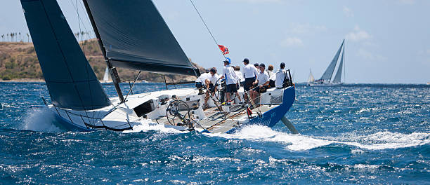 crew on a sailboat "Highland Fling XII" racing in regatta St. Thomas, US Virgin Islands - March 30, 2014: sailing crew on a sailboat "Highland Fling XII" (Monaco) racing in 2014 St. Thomas International Regatta regatta stock pictures, royalty-free photos & images