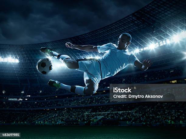 Soccer Player Kicking Ball Stock Photo - Download Image Now - Soccer, Soccer Ball, Soccer Player