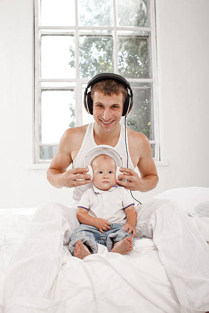 istock young father with his nine months old som on the 483692146