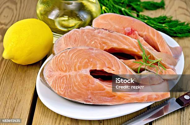 Trout In Plate With Lemon On Board Stock Photo - Download Image Now - Backgrounds, Condiment, Cooking Oil