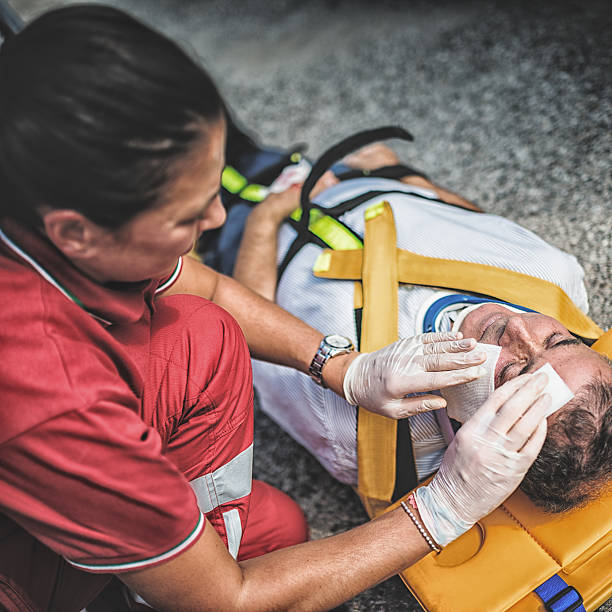 istock rescue team helping injured man 483692755