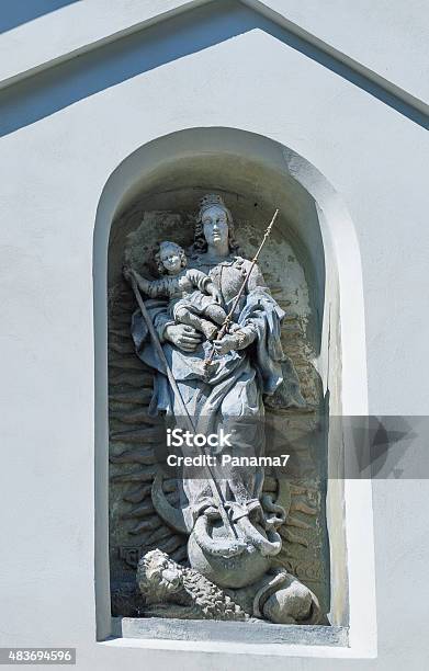 Virgin Mary Statue Over Gate To Lviv Armenian Cathedral Stock Photo - Download Image Now