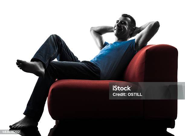 Man Sofa Coach Relaxing Stock Photo - Download Image Now - 2015, Back Lit, Cheerful