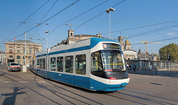 Tram passing the Bahnhofbruecke bridge Zurich, Switzerland - 6 September, 2014: tram passing the Bahnhofbruecke bridge. Zurich is the largest city in Switzerland and the capital of the Canton of Zurich. zurich train station stock pictures, royalty-free photos & images