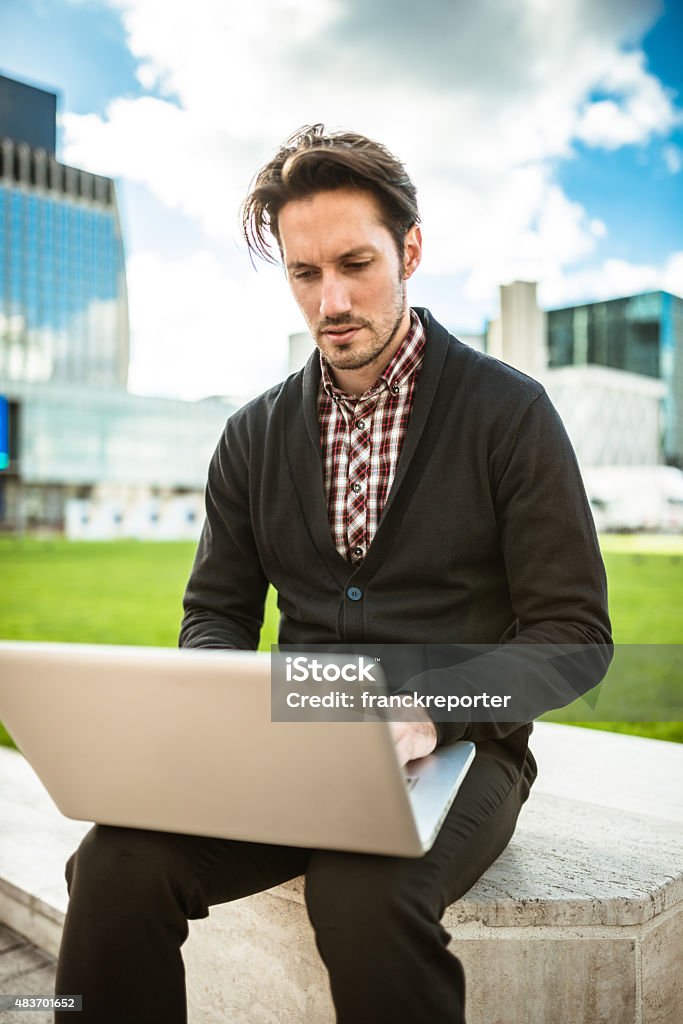 young adult entrepreneur on the phone young adult entrepreneur on the phone  2015 Stock Photo