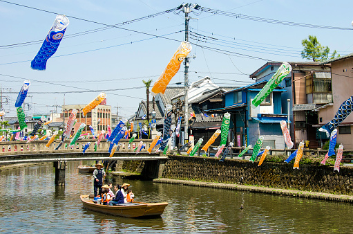 Tochigi, Japan-April 18, 2015: The people  enjoy the views of the storehouses and the river breezes on a sightseeing boat for about 15 minutes