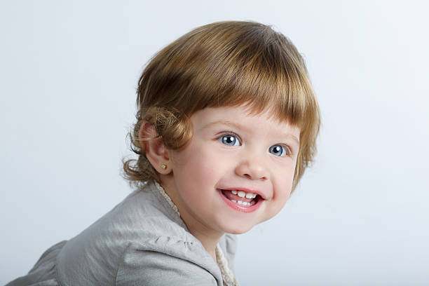 istock Cute laughing girl portrait 483702196
