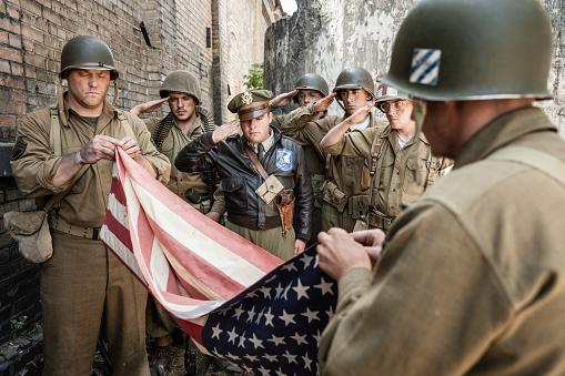 Vintage photograph of authentic World War II army soldier in battle reenactment.