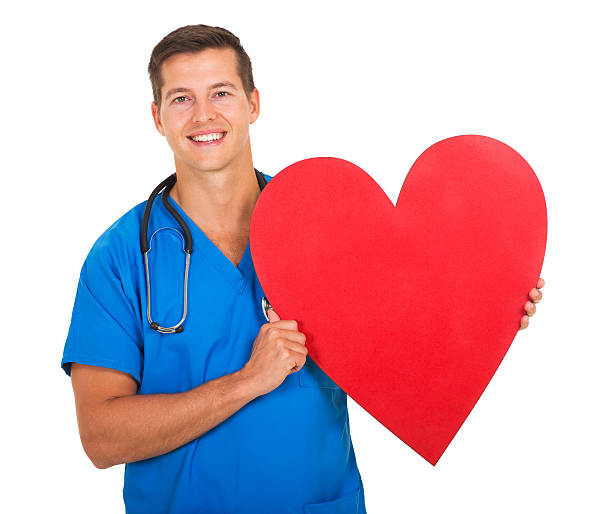 istock male nurse holding heart shape 483709100