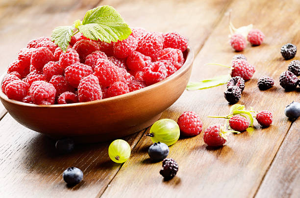 istock Ceramic bowl of organic raspberries 483709140