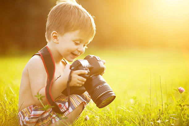 Happy baby playing in the field