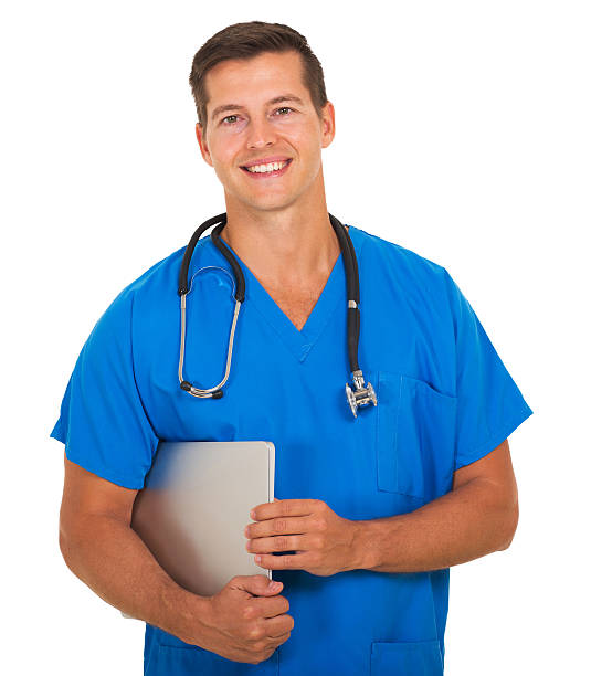 istock male nurse holding laptop computer 483712462