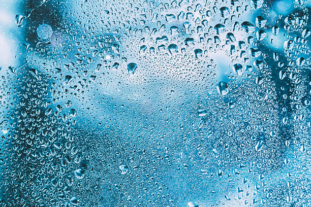 istock Water Drops Rain Blue Glass Background 483713996