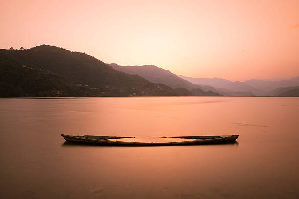 A tranquil scene in one of the most famous places in Nepal, the Phewa Lake in Pokhara.
