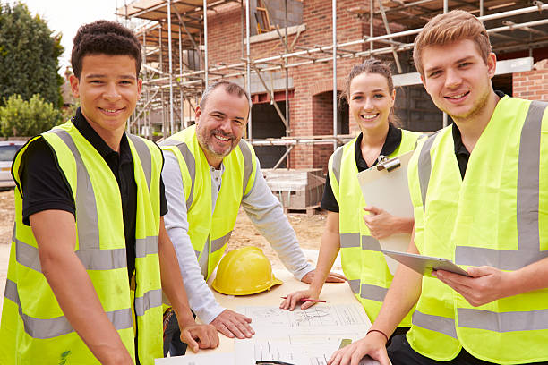 istock Portrait Of Builder On Building Site With Apprentices 483717766