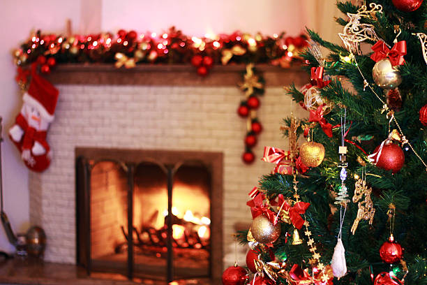istock Christmas tree in the background of the burning fireplace 483718663