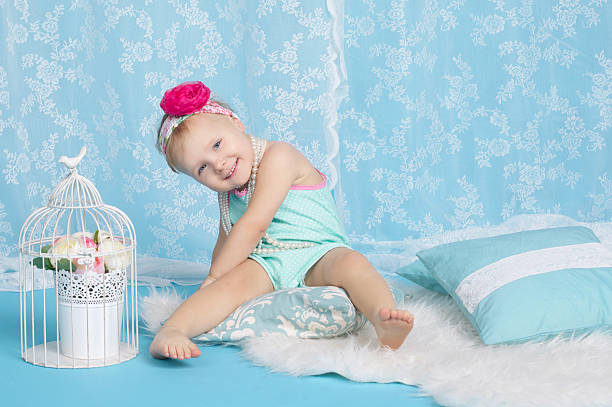 istock girl lying on floor studio portrait 483718790