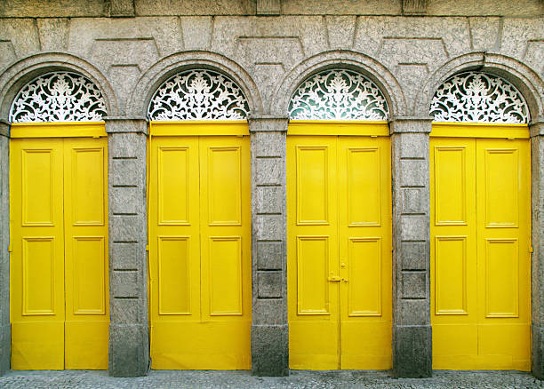 Entrance. Four doors of a colonial building