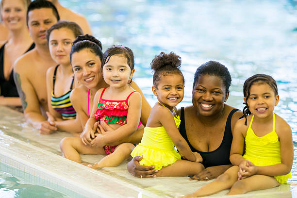 istock Families at the pool 483719679