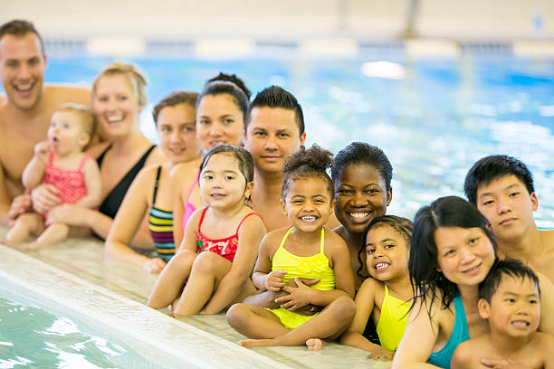 istock Families at the pool 483719719
