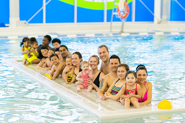 istock Families at the pool 483719749