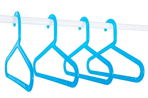 istock Blue hangers on a rod isolated on white 483721379