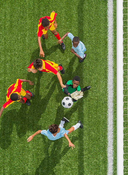 istock Young Boys Playing Football 483721547