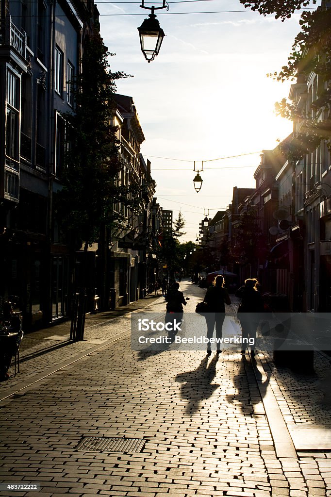 sunny late afternoon european shopping street Backlit  late afternoon european shopping street 2015 Stock Photo